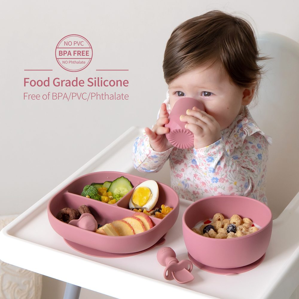 Baby drinking from a SAMiGO food grade silicone cup beside a suction plate